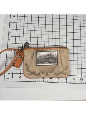 Coach Poppy Y2K Wristlet
Features Kissing Cs